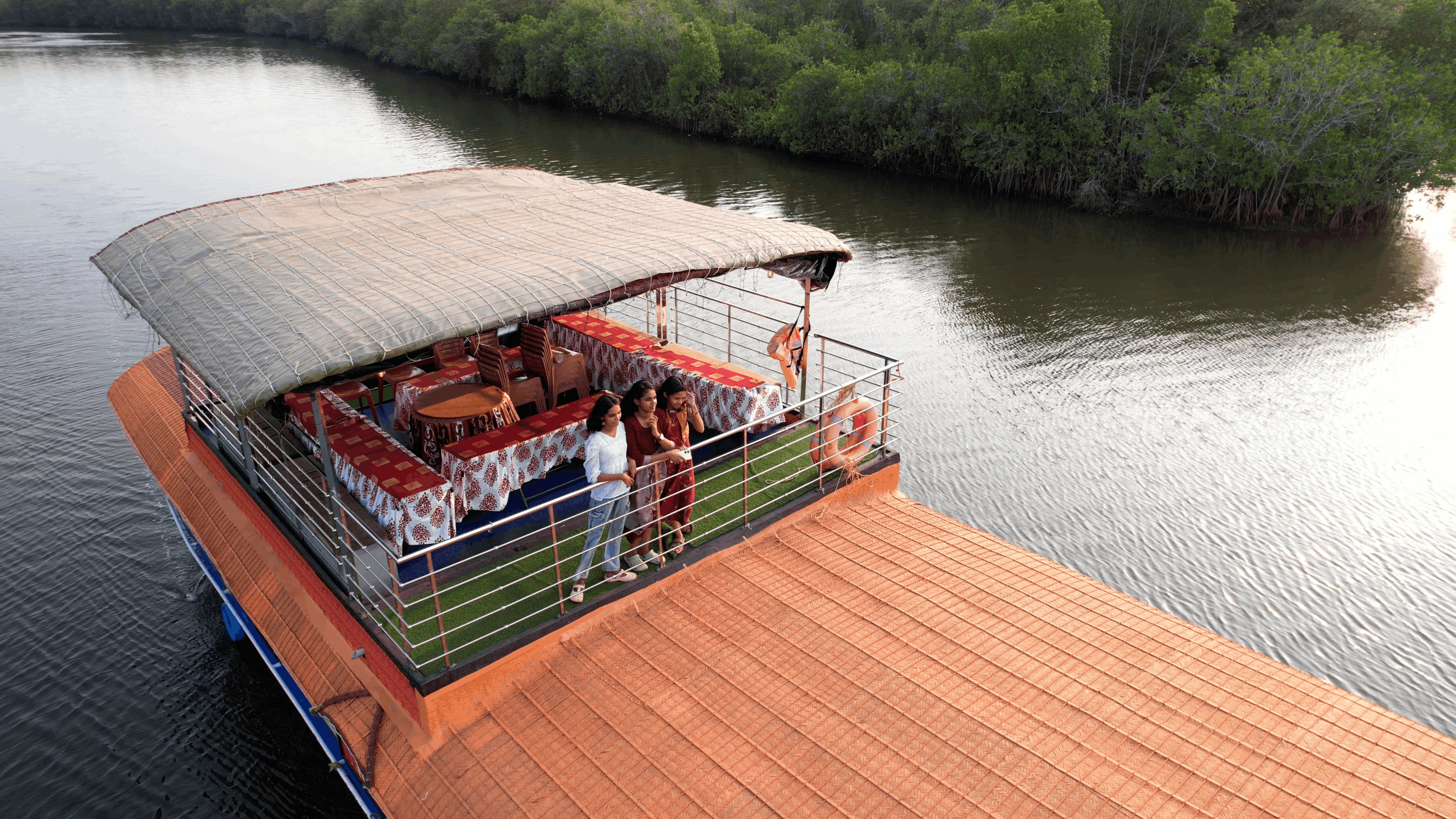 Guests on the deck of the houseboat