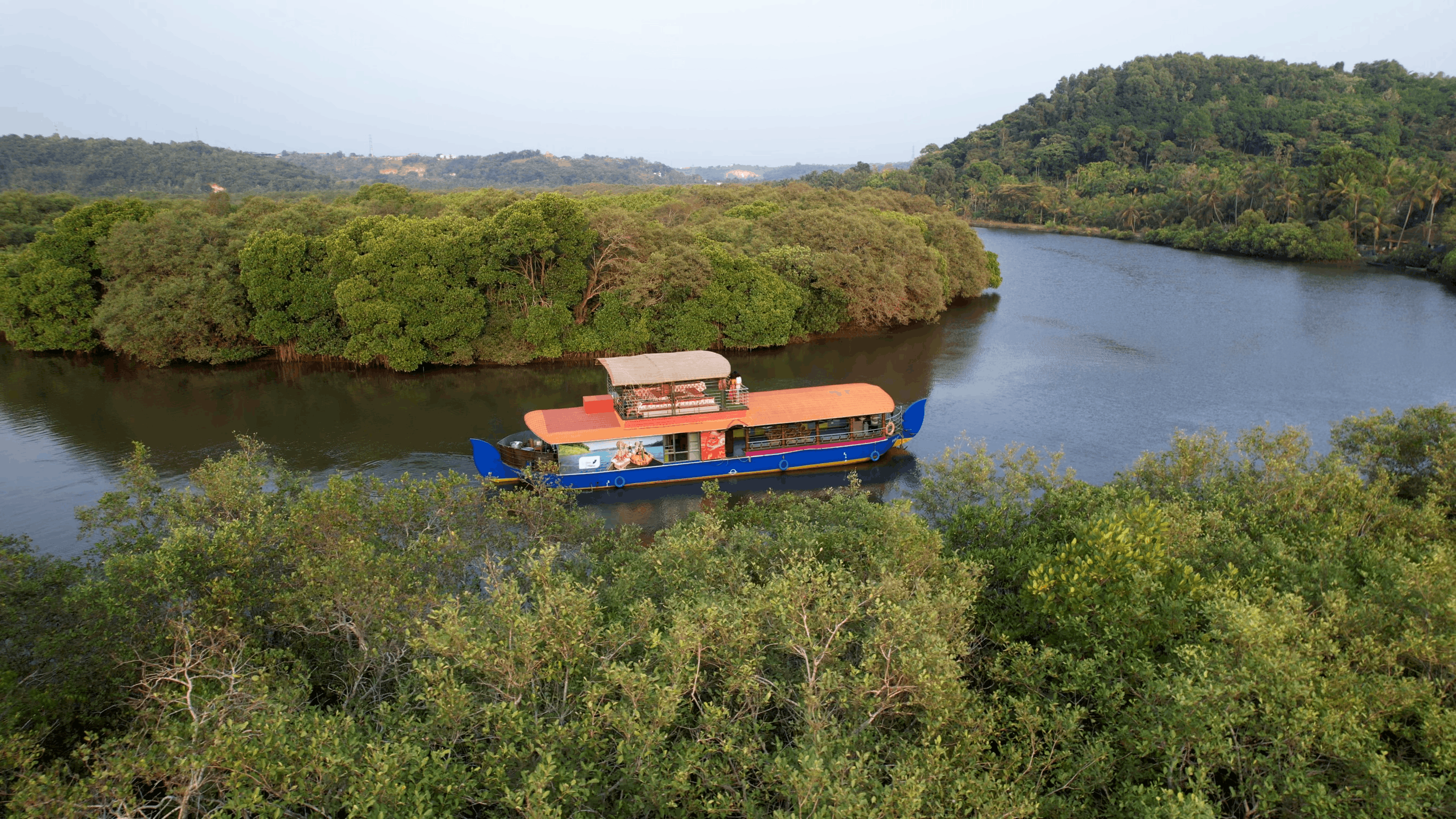 Vellikkeel waves houseboat in the middle of mangroves